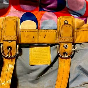 Used coach bag with some minor makeup spots.